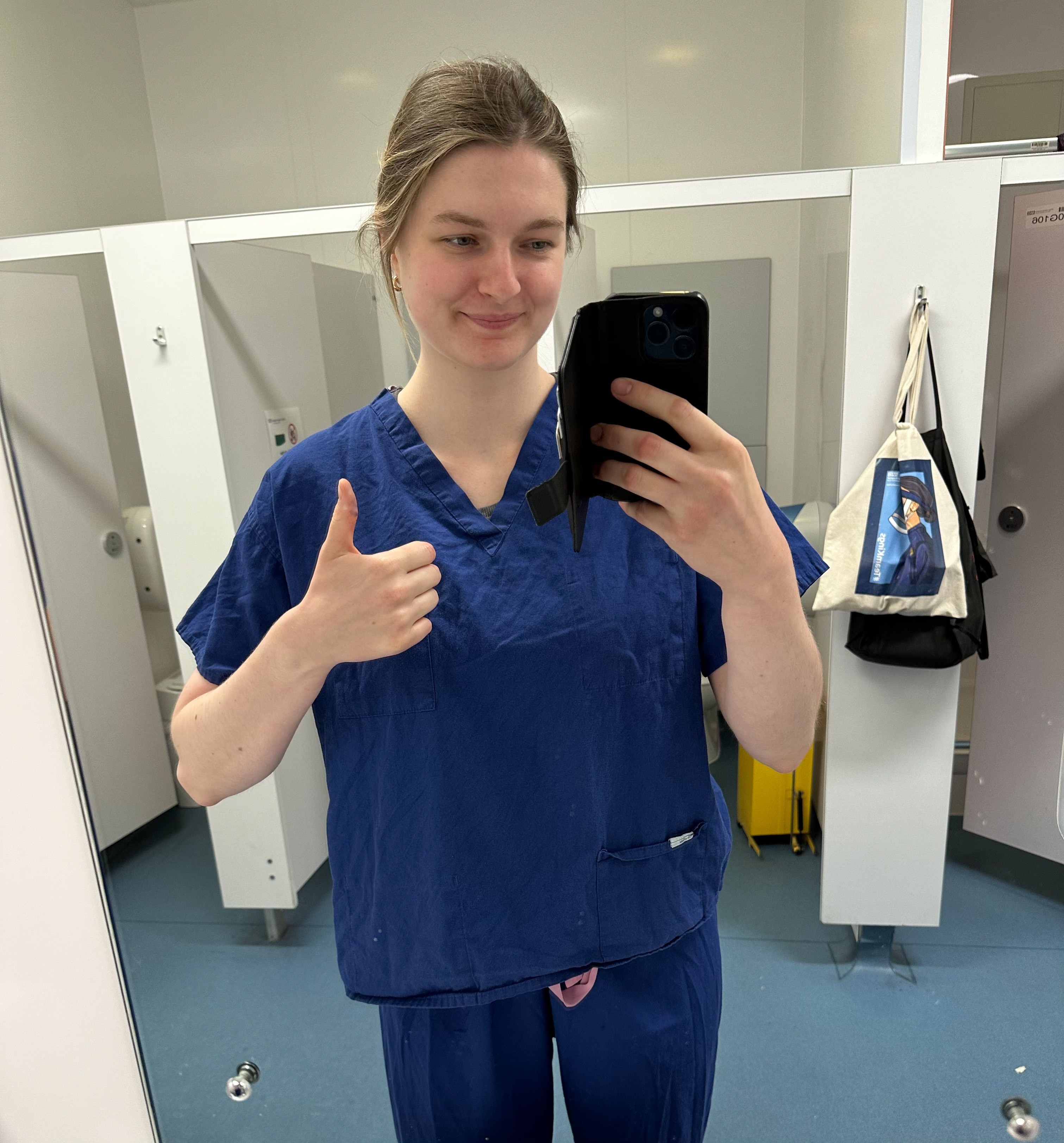 Ellen in scrubs at the Neurosurgery Department, King's College Hospital